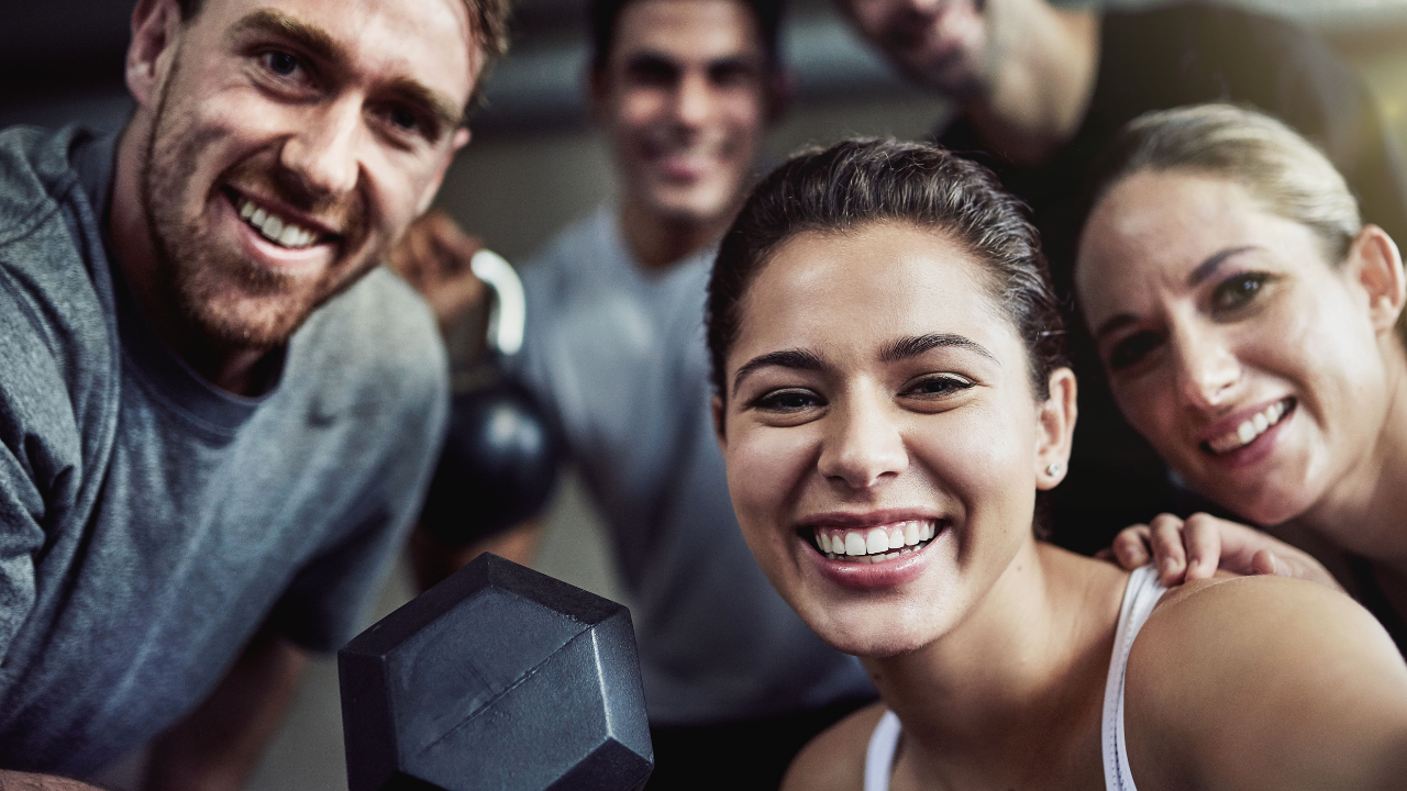 Group of people working out and smiling
